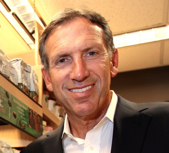 Image: Starbucks CEO Howard Schultz holds up a new Via coffee product at the Starbucks corporate headquarters in Seattle, Washington